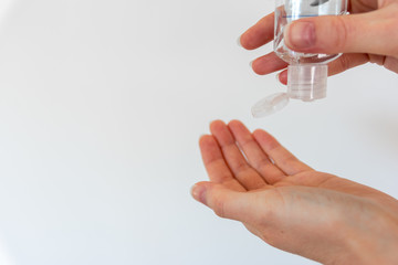Woman washing hands with hand sanitizer alcohol antibacterial to prevent germs, bacteria and avoid coronavirus infections