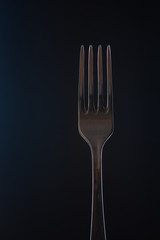 plug isolated on dark background, low key