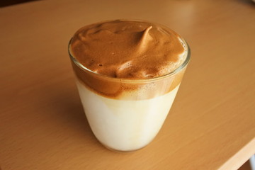 a cup of coffee drink, Dalgona coffee  - milk and formed coffee