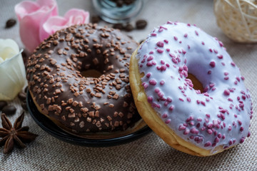 chocolate donuts with icing sugar