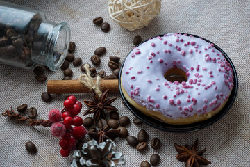 coffee beans and spices. Berry donuts with icing sugar