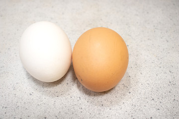 Two chicken eggs isolated on the table. Food concept.