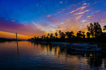 Naklejka premium Luxor. Nile river in Egypt. Sunset over the river in Egypt. Sunset in Luxor
