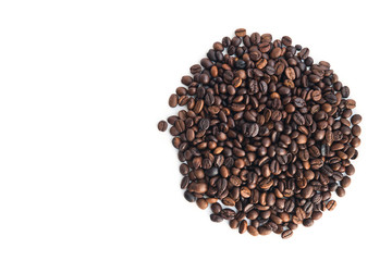 coffee beans, lie in the shape of a circle on a white background, top view