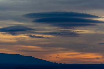 Fototapeta na wymiar Lenticular clouds at sunset in the sky of Andalusia