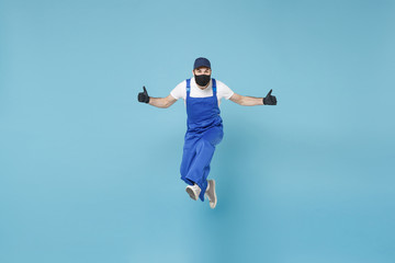 Fun jumping delivery man in cap t-shirt uniform sterile face mask glove isolated on blue background studio Guy employee courier Service quarantine pandemic coronavirus virus covid-19 2019-ncov concept