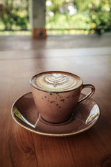 A cup of coffee with latte art on top