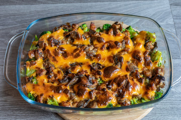 Chicken casserole with broccoli and mushrooms in sour cream sauce