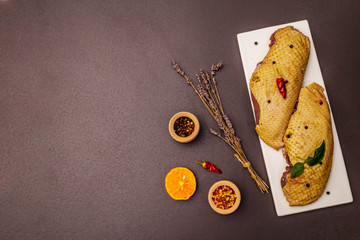 Raw duck breasts and spices. Delicious ingredient for cooking healthy meal