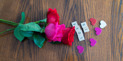 Valentine day red roses with letter tileto show love