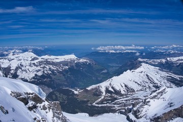 Fototapeta na wymiar Panoramic view of glaciers and alps mountain range from the top of Jungfrau peak in Switzerland