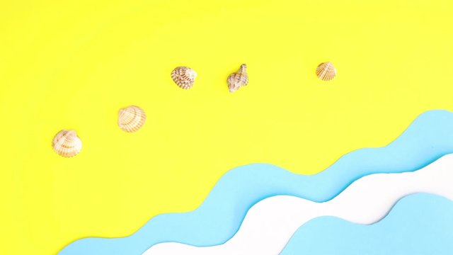 Sea waves and shells appear on beach - Handcrafted stop motion 