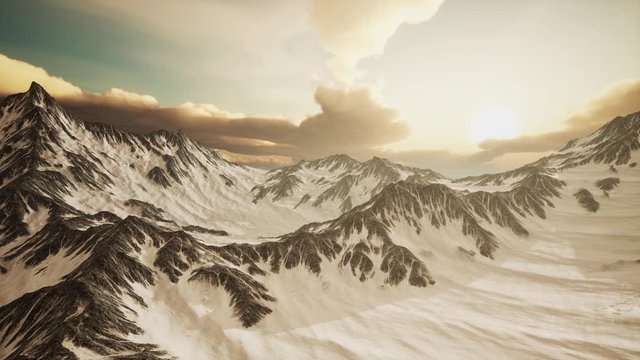 rays of sunset on the tops of the mountains on a sunny day