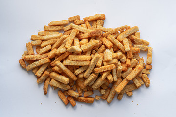 Long, golden breadcrumbs sprinkled with a slide