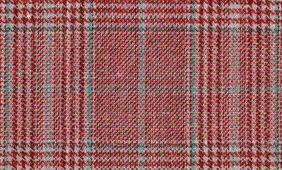 Glenurquhart check is made of red, brown woolen fabric. Tweed, Wool Background Texture. Coat close-up. Expensive men's suit. High resolution