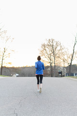 woman running on the road