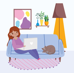 working remotely, young woman sitting on sofa with laptop and cat