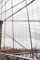 Fototapeta premium Brooklyn bridge. Rainy Brooklyn bridge view. Brooklyn bridge close up view. Rainy day at Brooklyn bridge. 