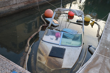 sunken ship in silent  harbor 