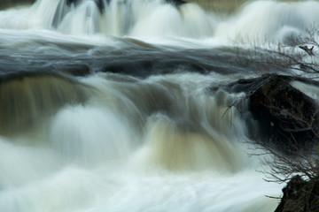 Fototapeta na wymiar Silky water of Cargill Falls of the Quinebaug River, Connecticut.