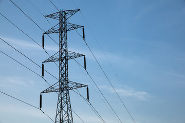 Electric power pole and line with blue sky background