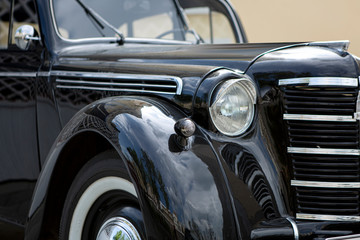 Obraz na płótnie Canvas Old black soviet retro and vintage car close-up without logo, soft and selective focus.