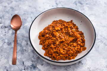 plant-based food, vegan lentil curry with tomato sauce onion and potatoes