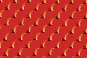 Crispy chips on a red background. Modern Food pattern