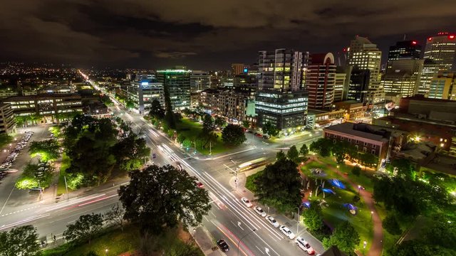Nighttime time lapse overlooking city traffic at a crossroad as clouds roll in, Adelaide (Australia)