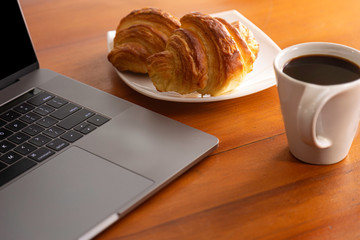 Having breakfast before online meeting. Selective focus