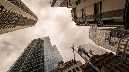 Looking up at tall skyscraper high rise buildings in Sydney city from a unique perspective.