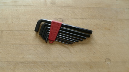 Fototapeta na wymiar a set of hex keys on a wooden background