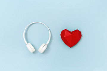 Volumetric paper heart and white headphones.  Concept for music festivals, radio stations, music lovers.  Live with music. Minimal style.