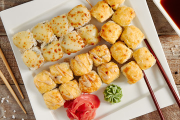 Baked rolls in white plate top view