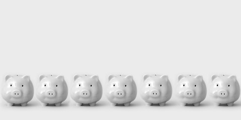 Monochrome image of seven piggy banks standing in line