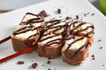 Chocolate pancake in ceramic white plate