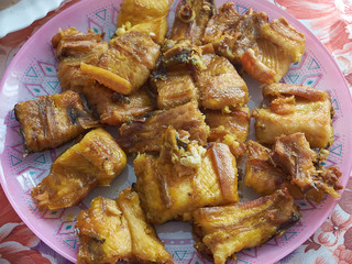 Pieces of hot smoked sterlet are placed in a plate