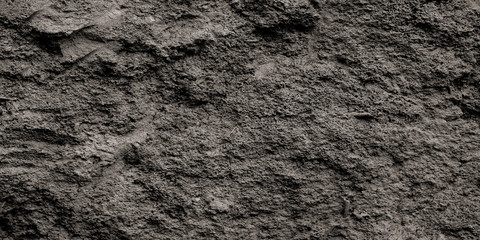 Gray stone texture, rough concrete wall background.