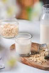 Homemade oat milk on light background
