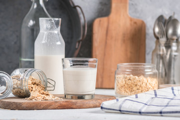 Homemade oat milk on light background