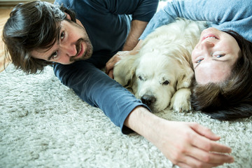 Young couple with dog at home