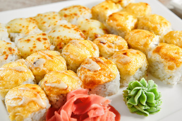 Baked rolls in white plate top view