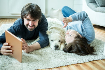 Young couple with dog at home