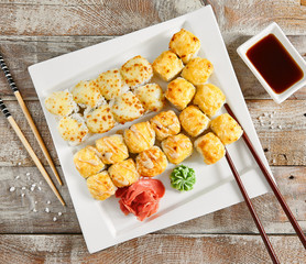 Baked rolls in white plate top view
