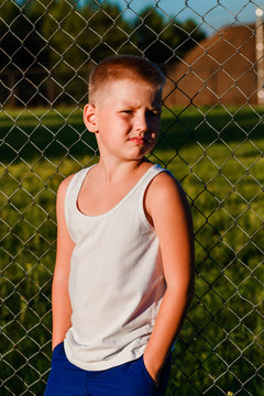 eight-year-old boy in a white T-shirt in the summer