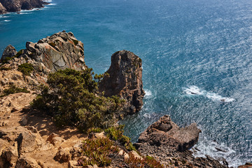 rocky landscape in the atlantic ocean. rocky cliff into the ocean portugal.