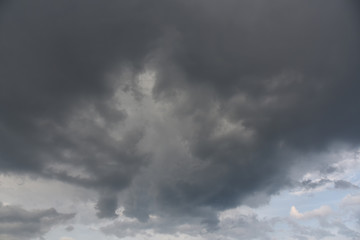Rain clouds background. Clouds become dark gray like a big smoke before rainfall. Concept the rainy season Thunderstorm is a storm with lightning and thunder.