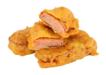 Batter covered fried spam luncheon meat fritters isolated on a white background