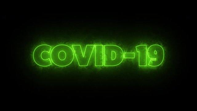 COVID-19 text word written in glowish green letters on a black background. Animated Graphic motion design illustration advertising 4K UHD. Health, security, Pandemic, world lockdown.