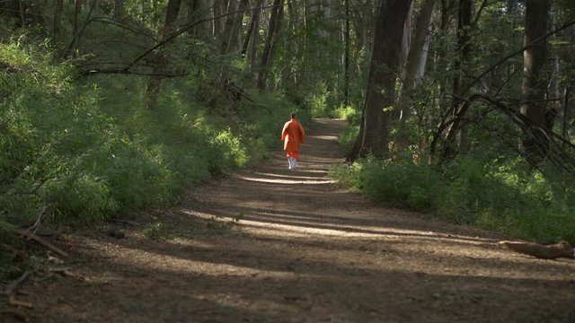 Man Dressing as a Monk walking